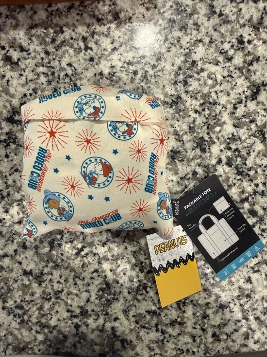 Bioworld Handbags - Peanuts Packable Cream Tote with Red and Blue Rodeo Motif